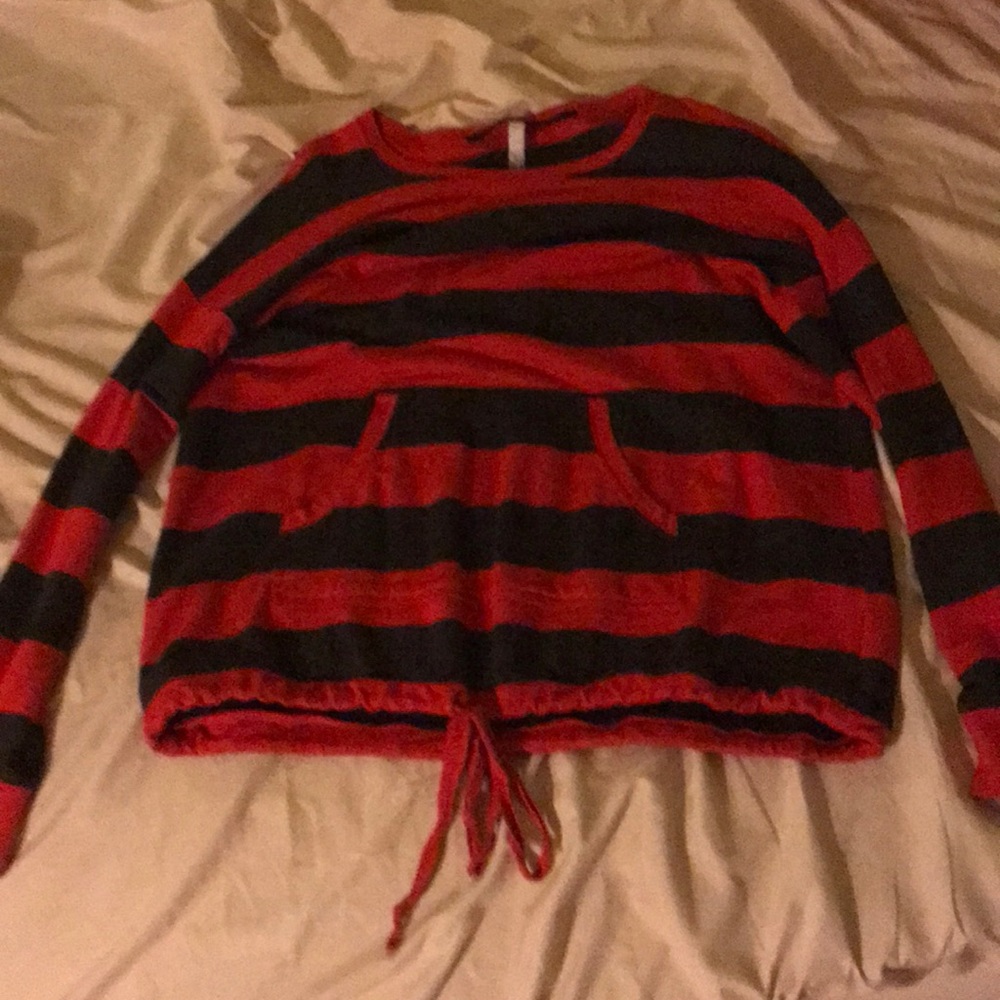 A gray and red striped sweater